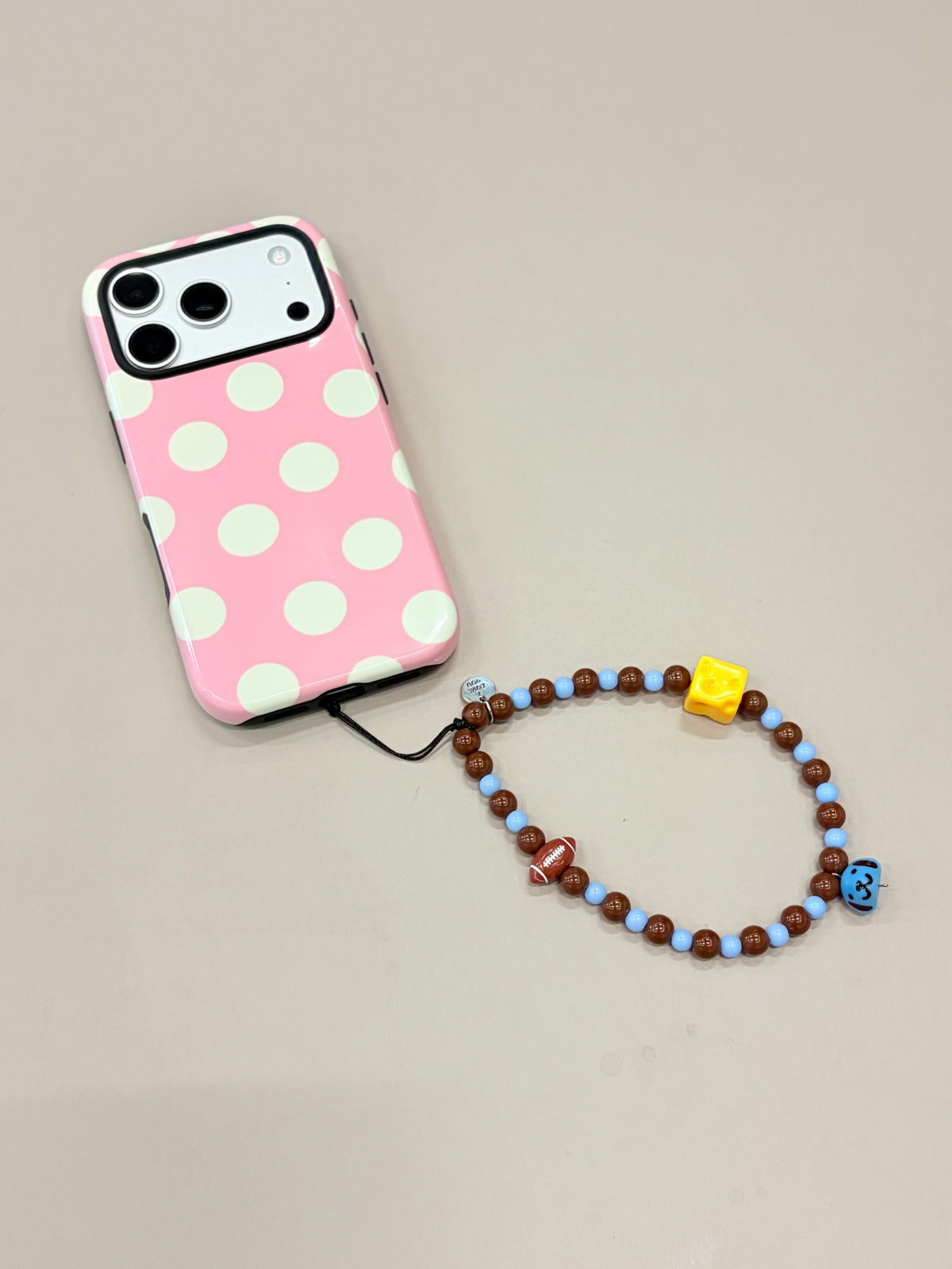 Cartoon beaded phone strap with decorative bead design
