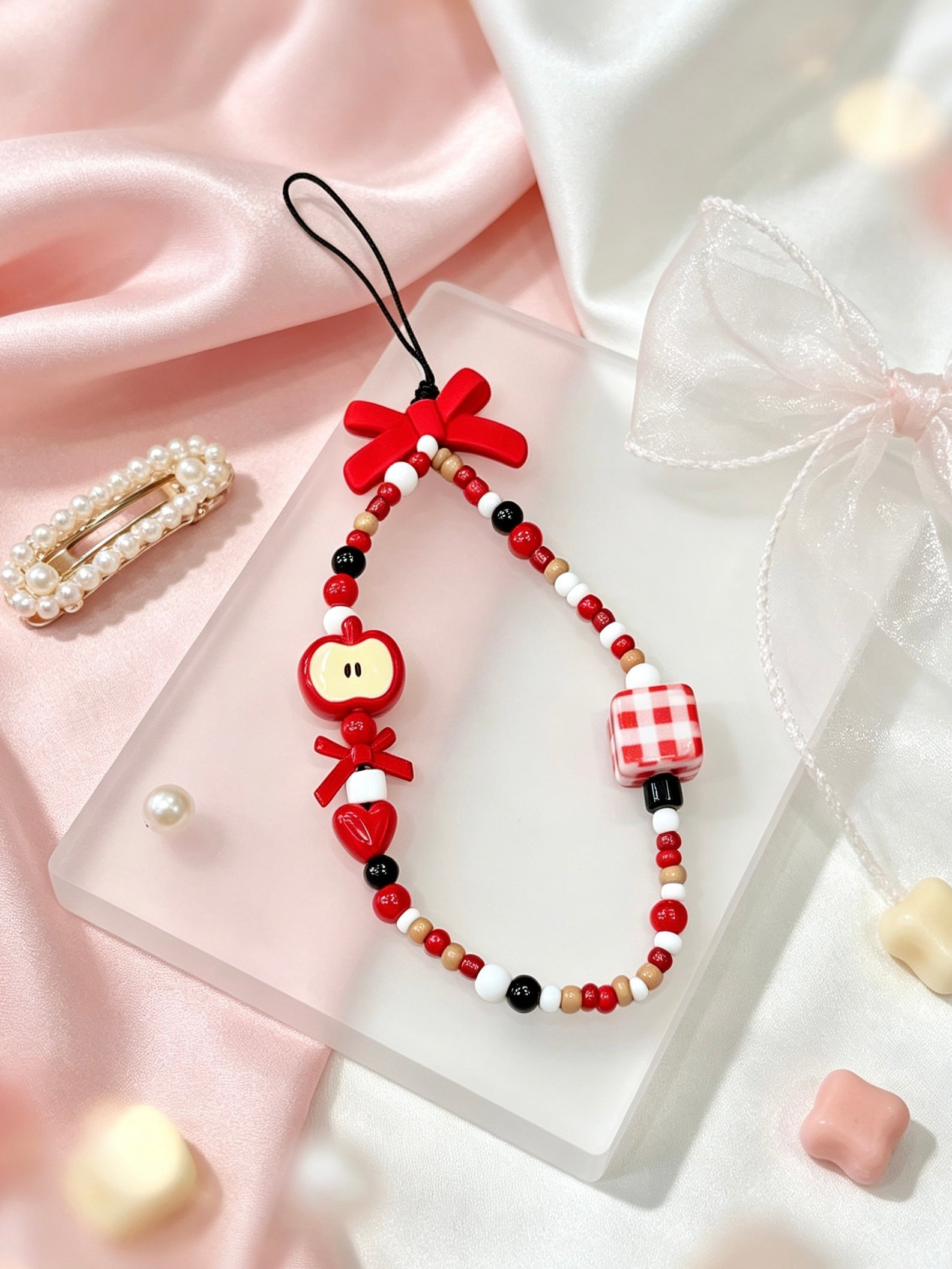 Close-up detail of bow bead phone strap accessory