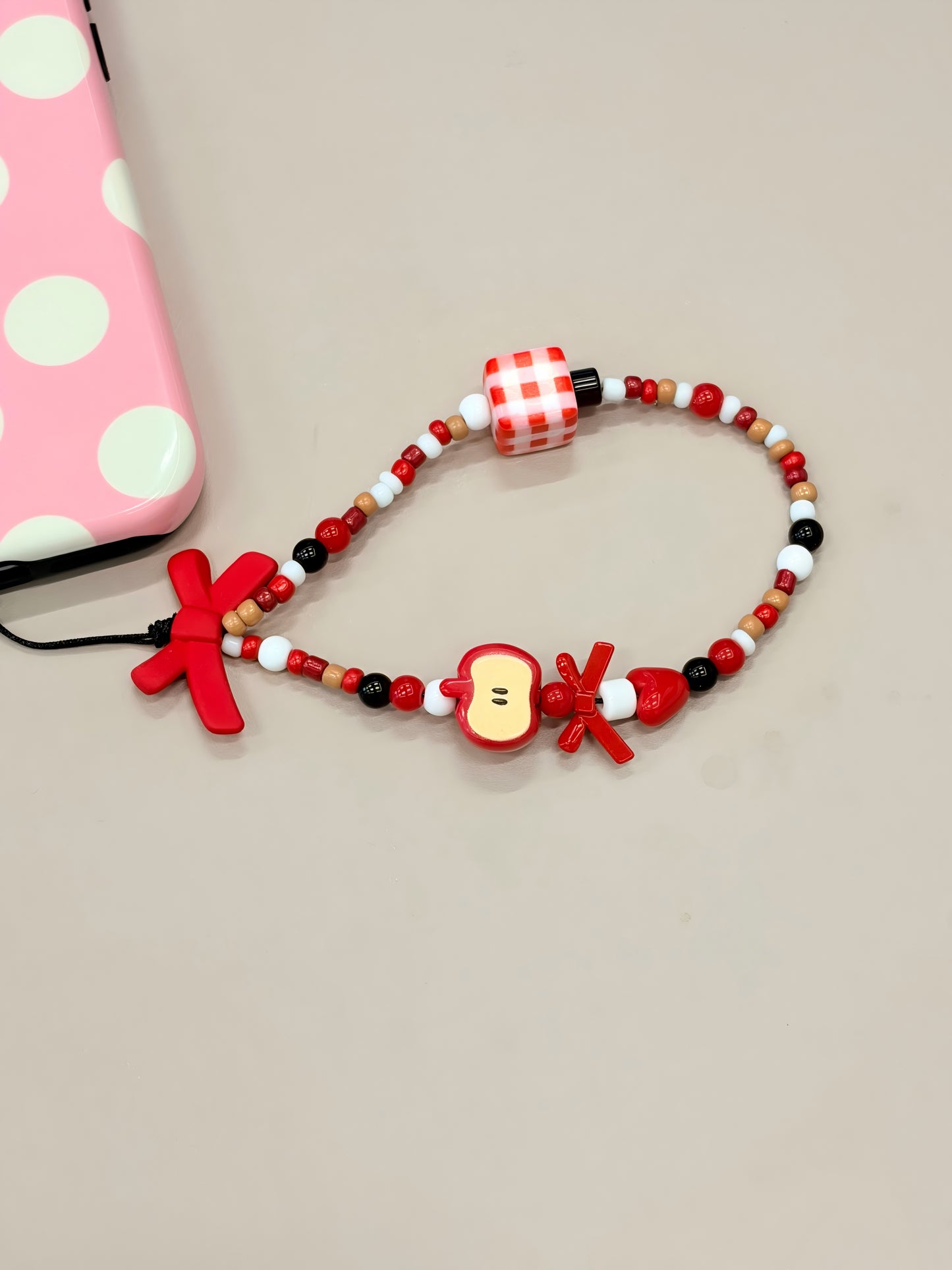 Bow beaded phone strap with handmade decorative design