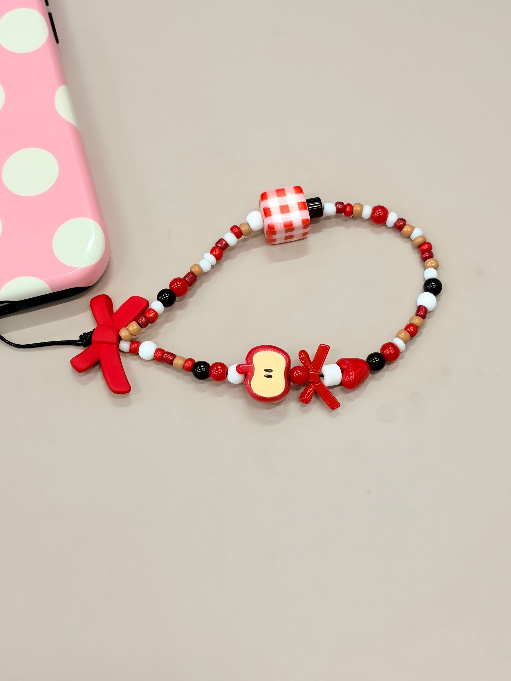 Bow beaded phone strap with handmade decorative design