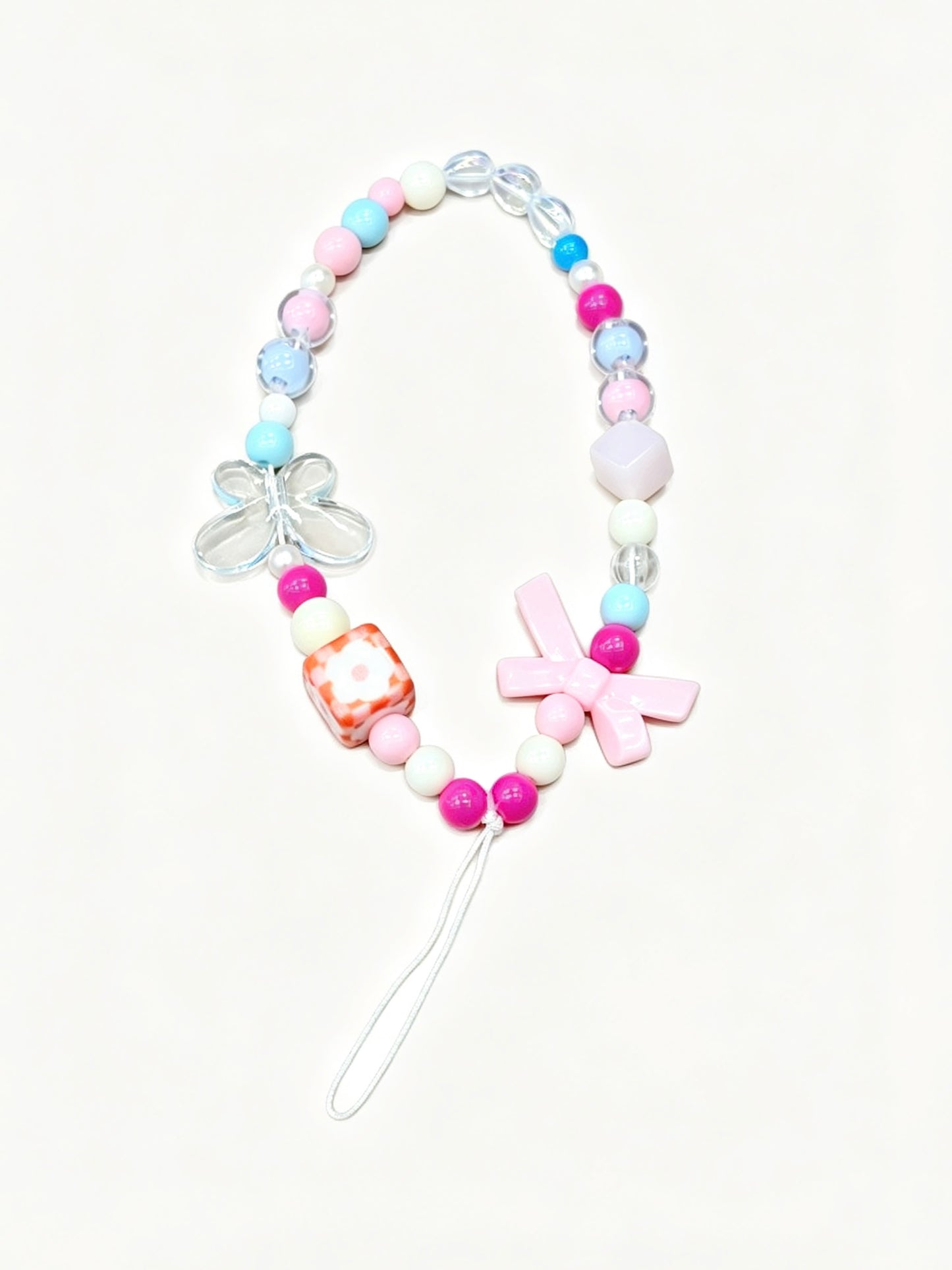 Butterfly charm phone strap attached to phone case