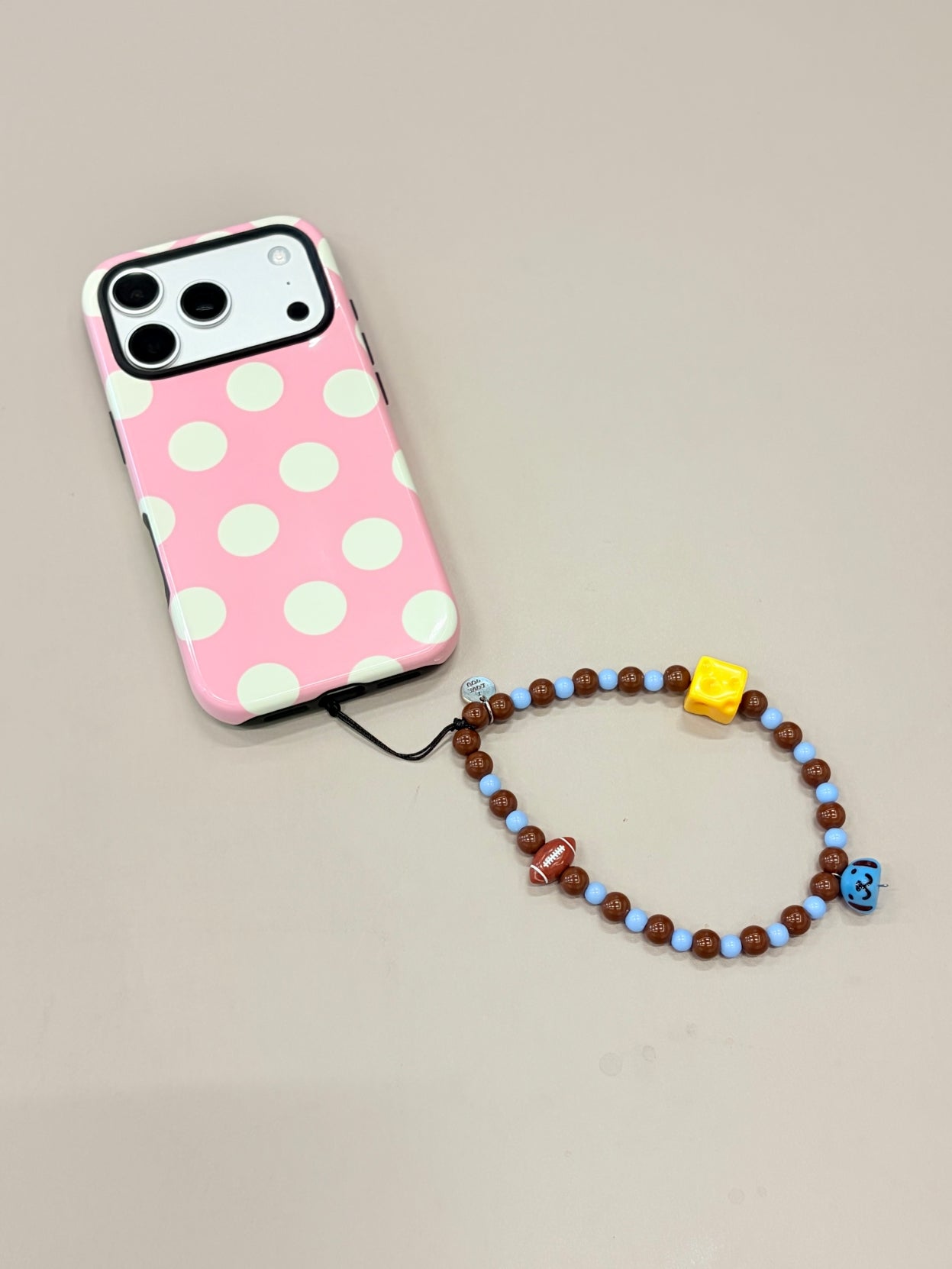 Cartoon beaded phone strap with decorative bead design