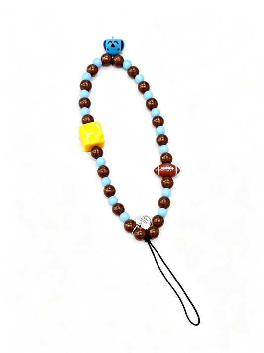 Close-up view of cartoon bead phone strap accessory