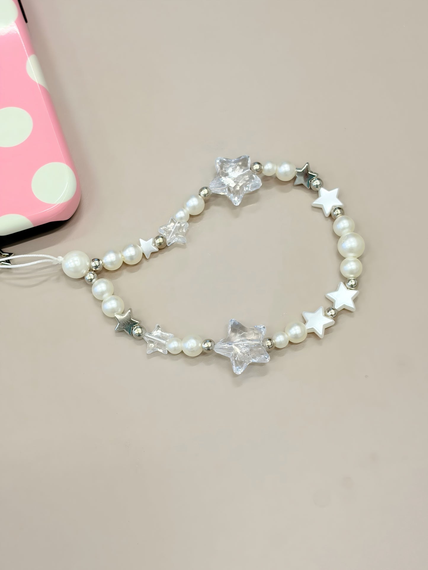 Pearl star phone strap with decorative design