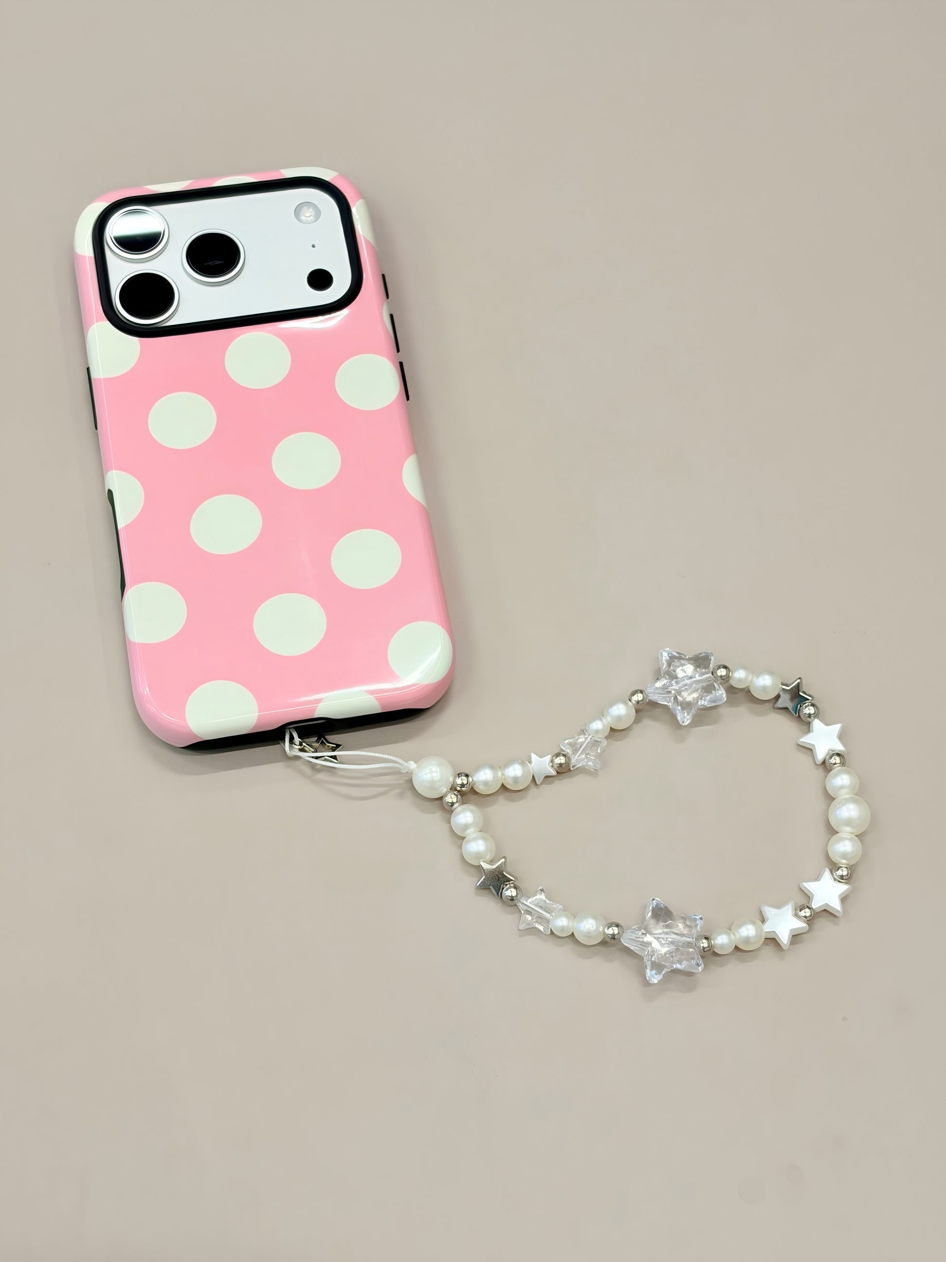 Pearl star phone strap attached to phone case