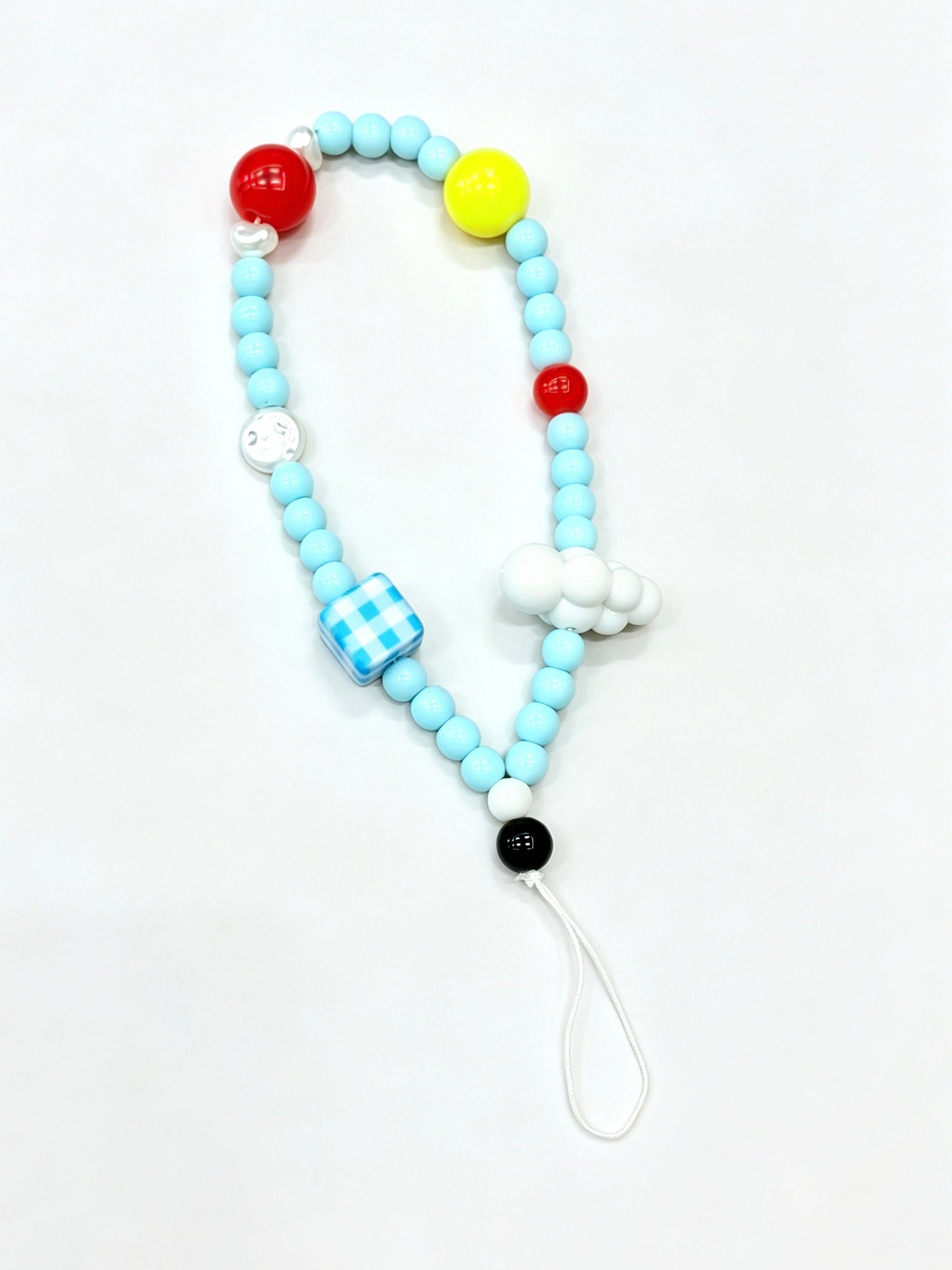 Close-up detail of sky cloud bead phone strap