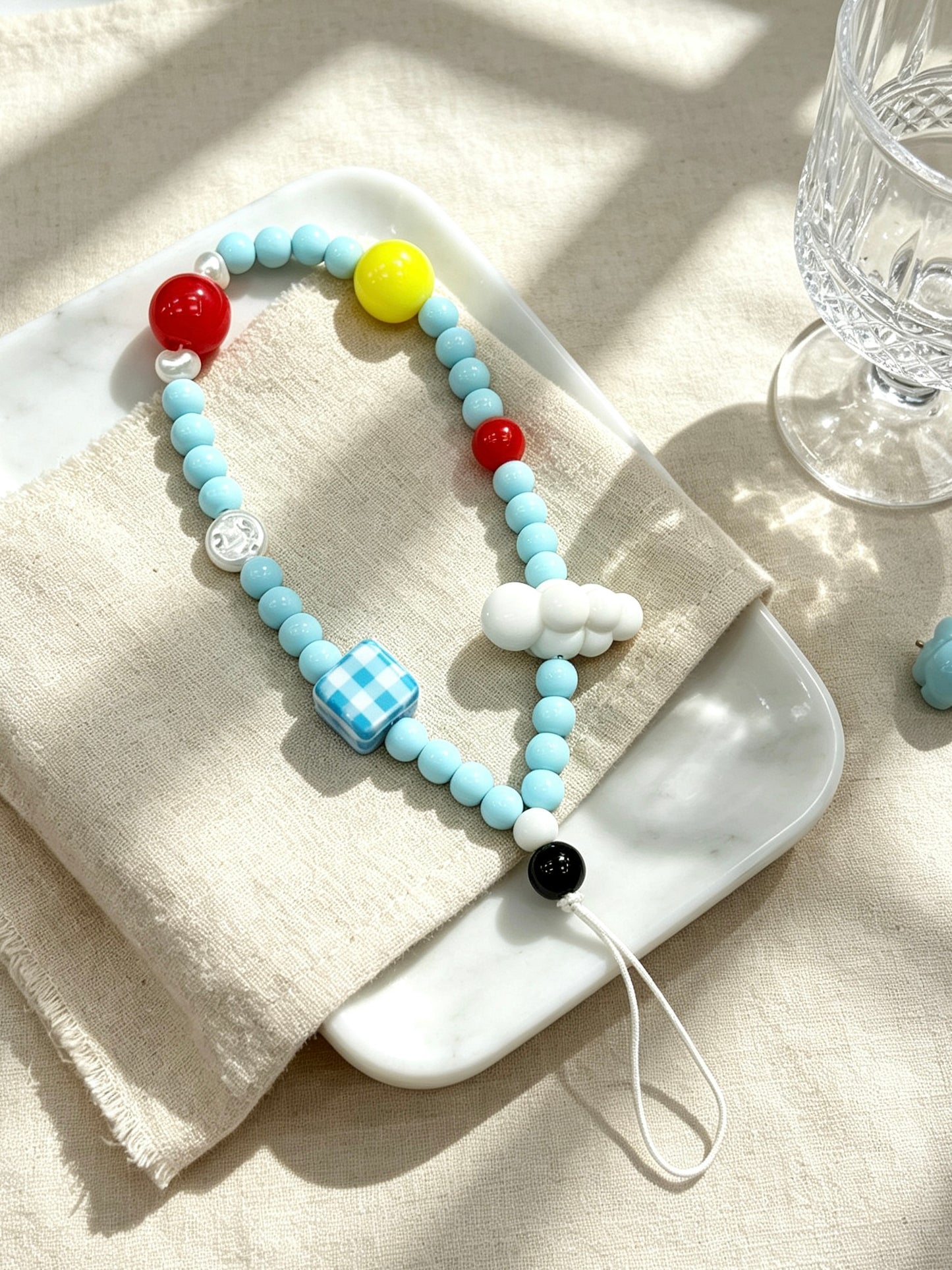 Sky cloud beaded phone strap with handmade decorative design