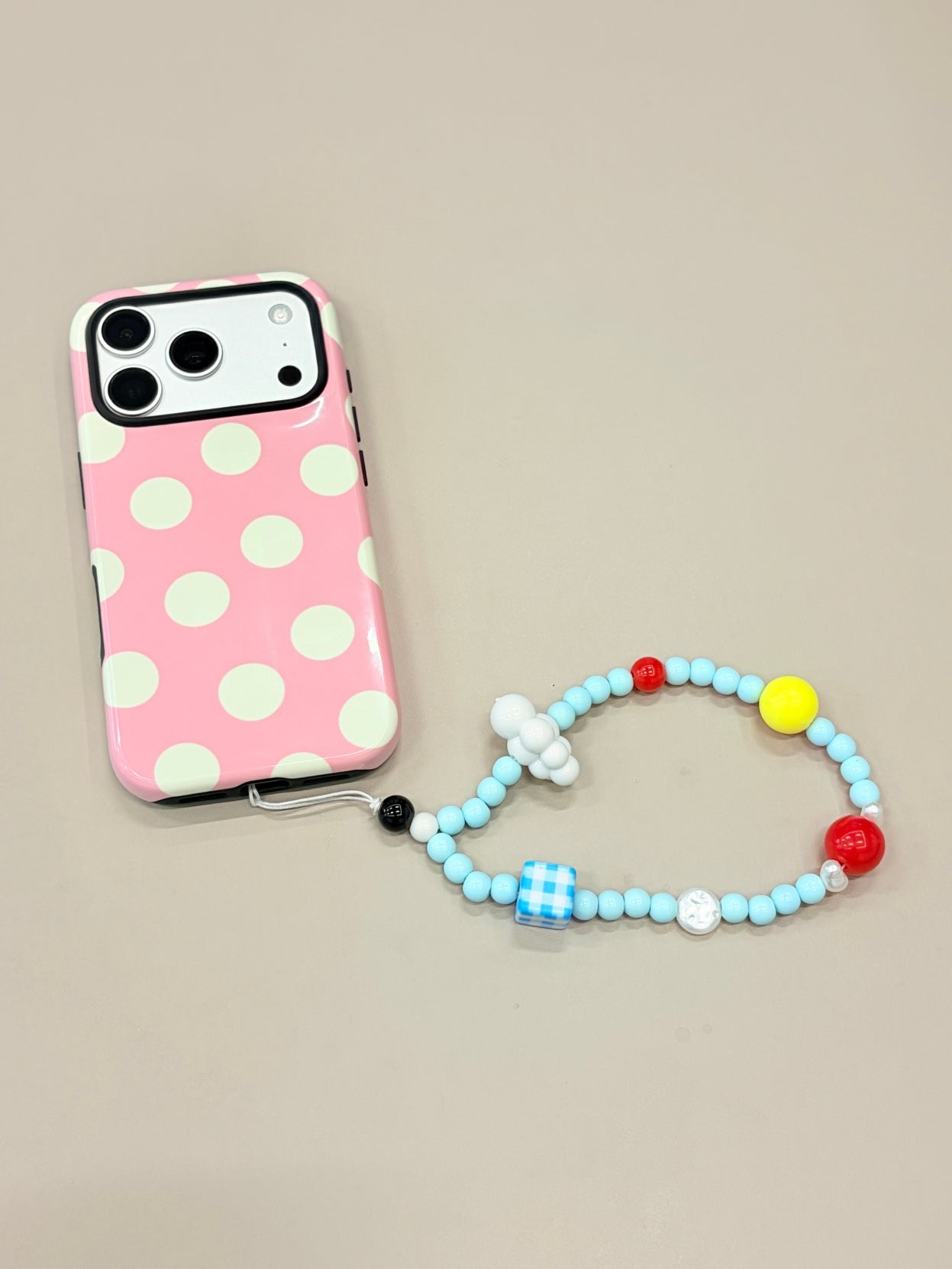 Sky cloud beaded phone strap attached to mobile phone case