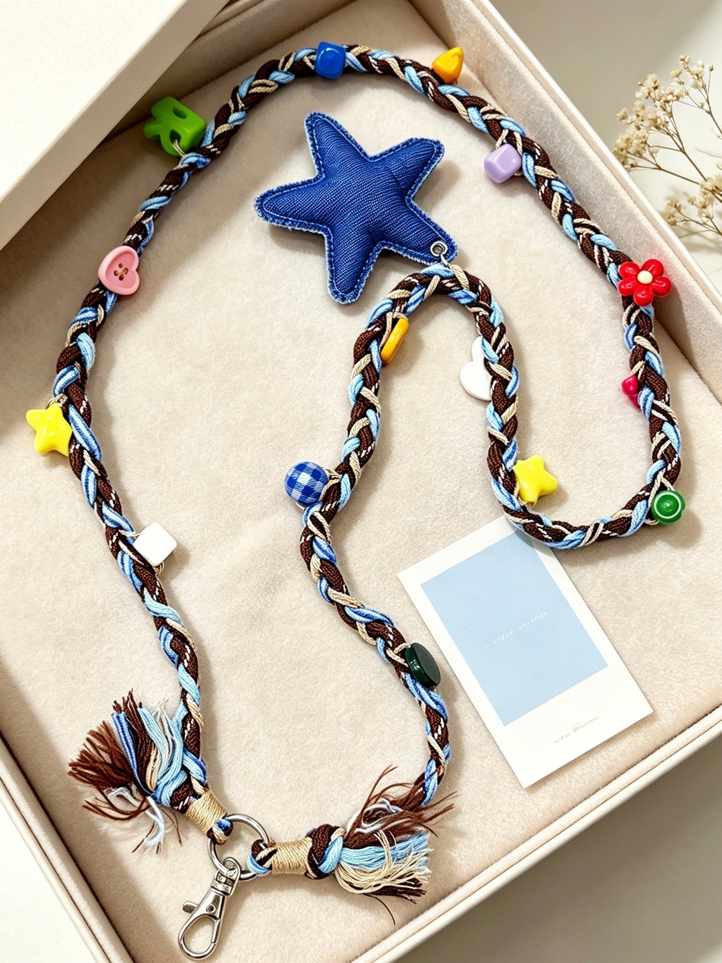 Star beaded phone strap displayed in daily use scene